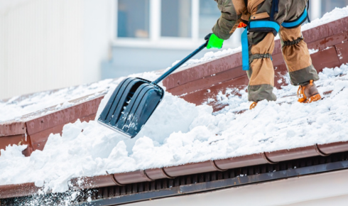 How can taking note of where snow, dew or rain lingers longest on the roof show potential trouble spots