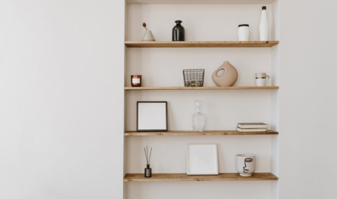In what way can a simple wall-mounted shelf change how you use a narrow passage