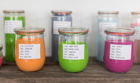 Why is it useful to keep a small labelled jar of leftover paint for future touch-ups