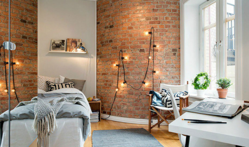 Why might adding a small lamp in a dark corner make the whole room feel softer